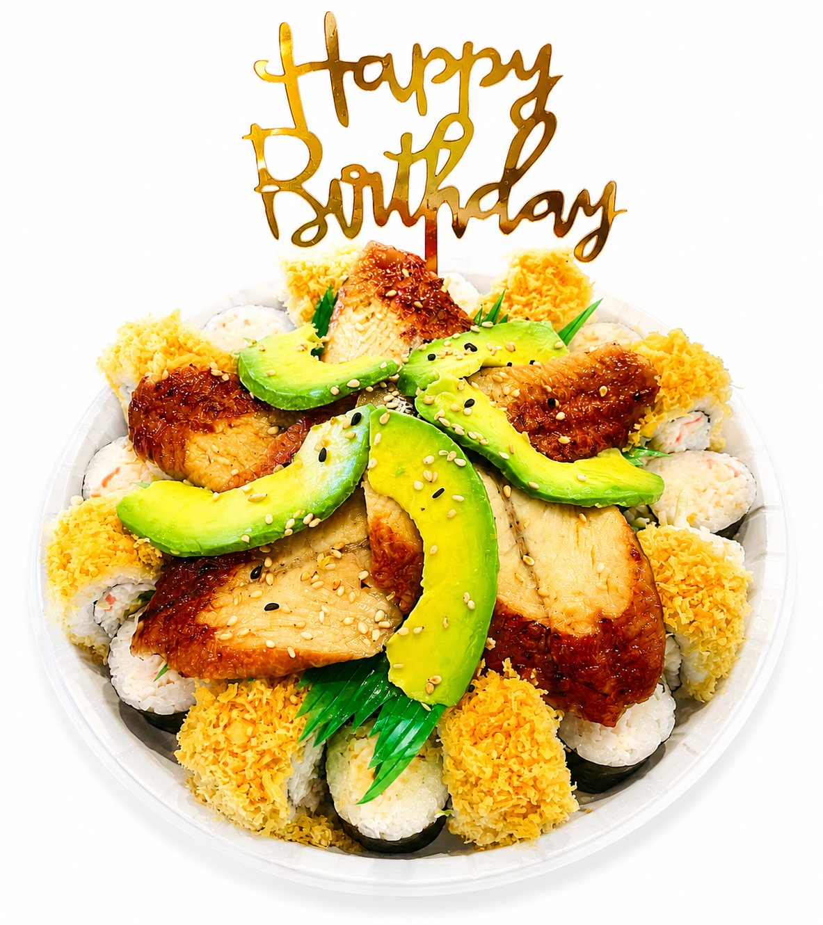 A round white plate filled with assorted sushi rolls topped with avocado slices, sesame seeds, and crispy fried pieces, with a gold 'Happy Birthday' cake topper inserted in the center on a white background.