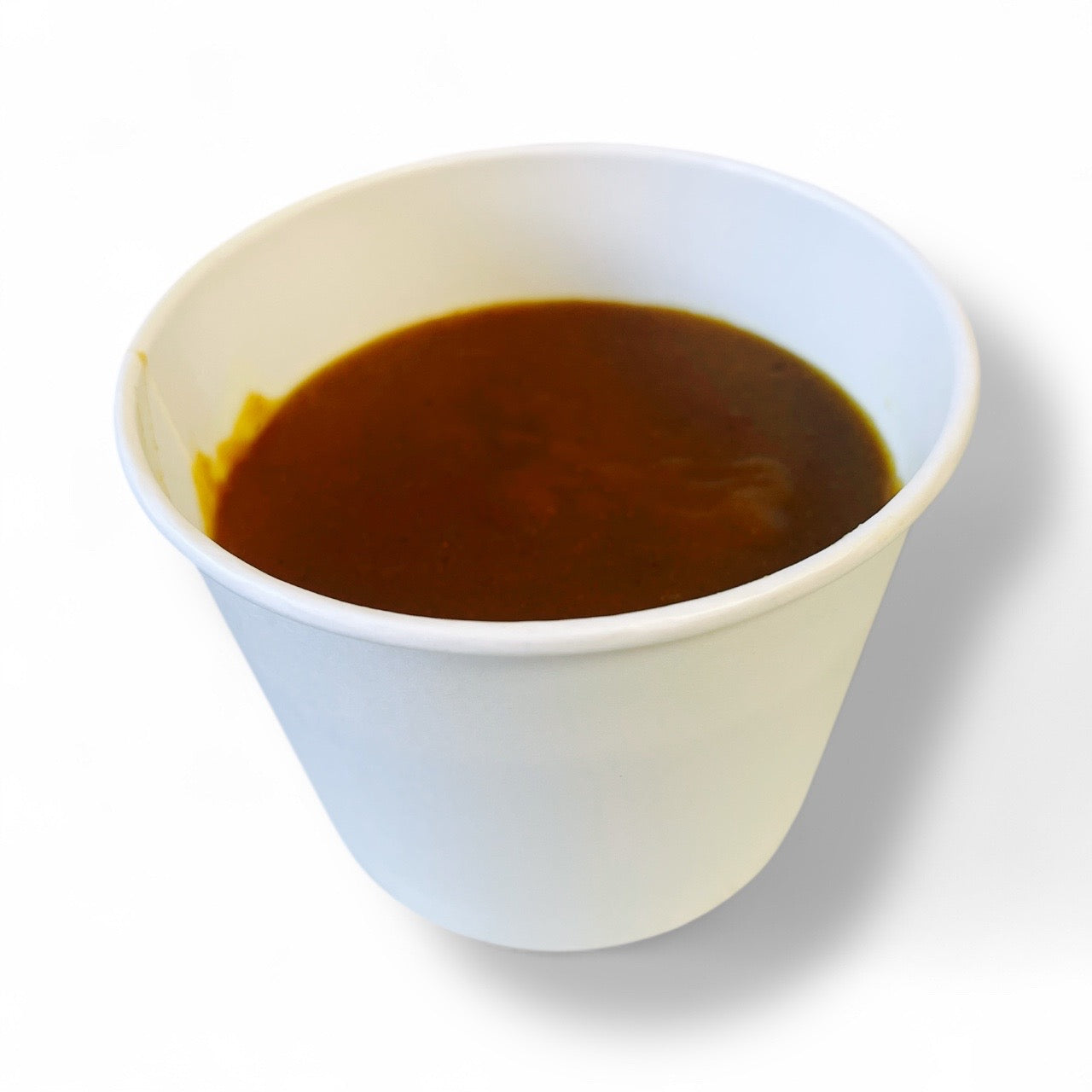 curry sauce in white cup in white background