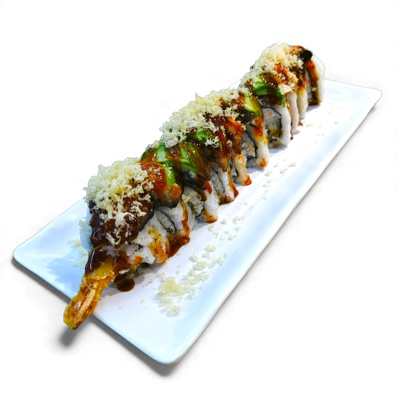 Sushi roll with avocado and other ingredients on a white plate