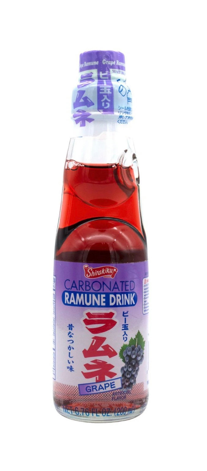 Bottle of carbonated ramune drink with grape flavor on a white background