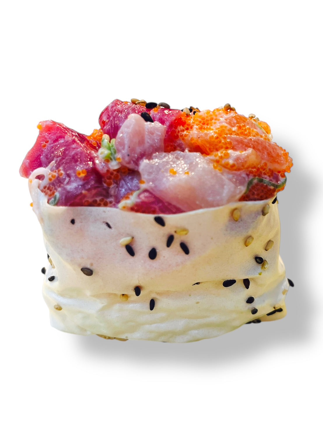 Rainbow sushi topped with assorted fresh fish including tuna, salmon, and yellowtail mixed with masago, wrapped with sesame rice  on a white background