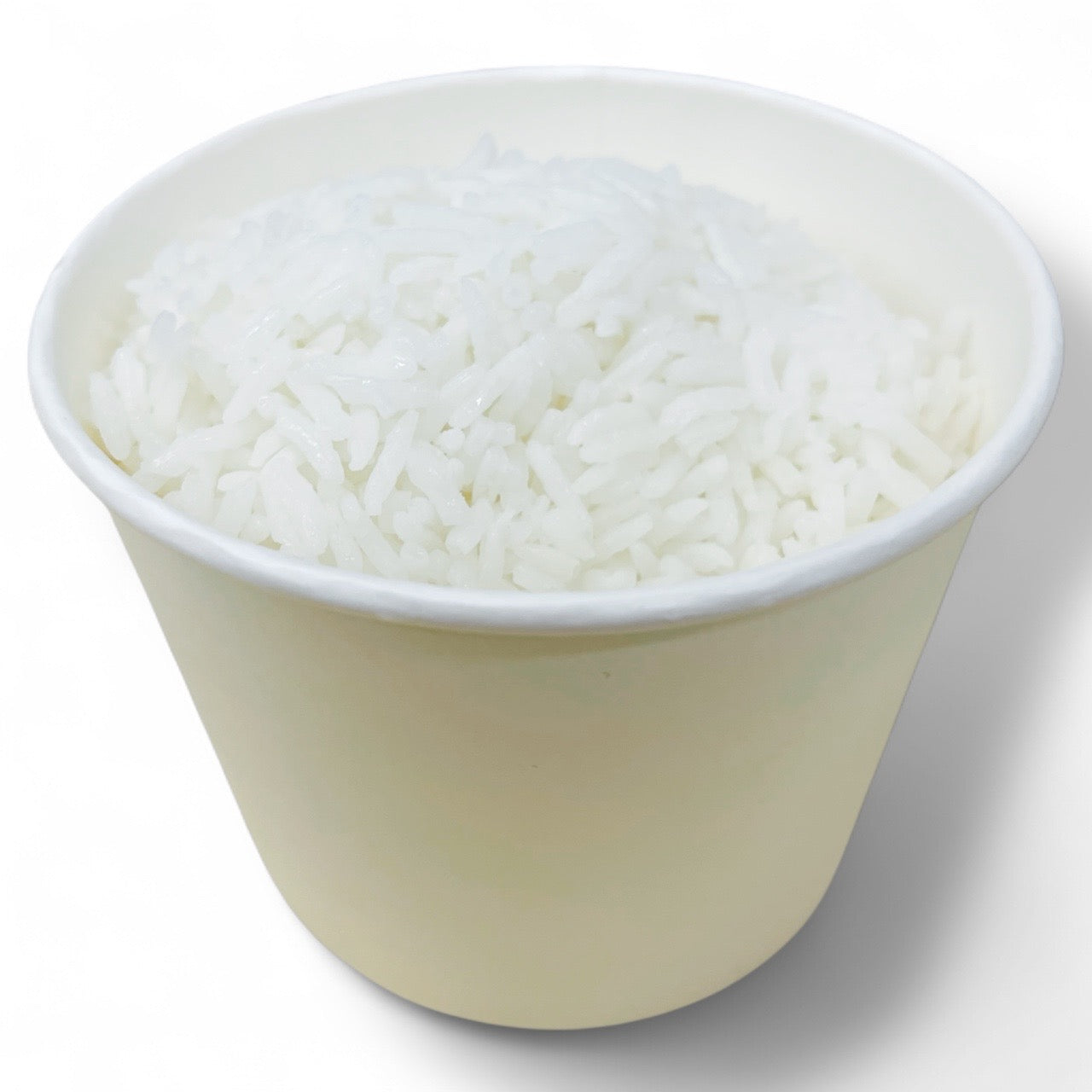 White bowl filled with white rice on a white background