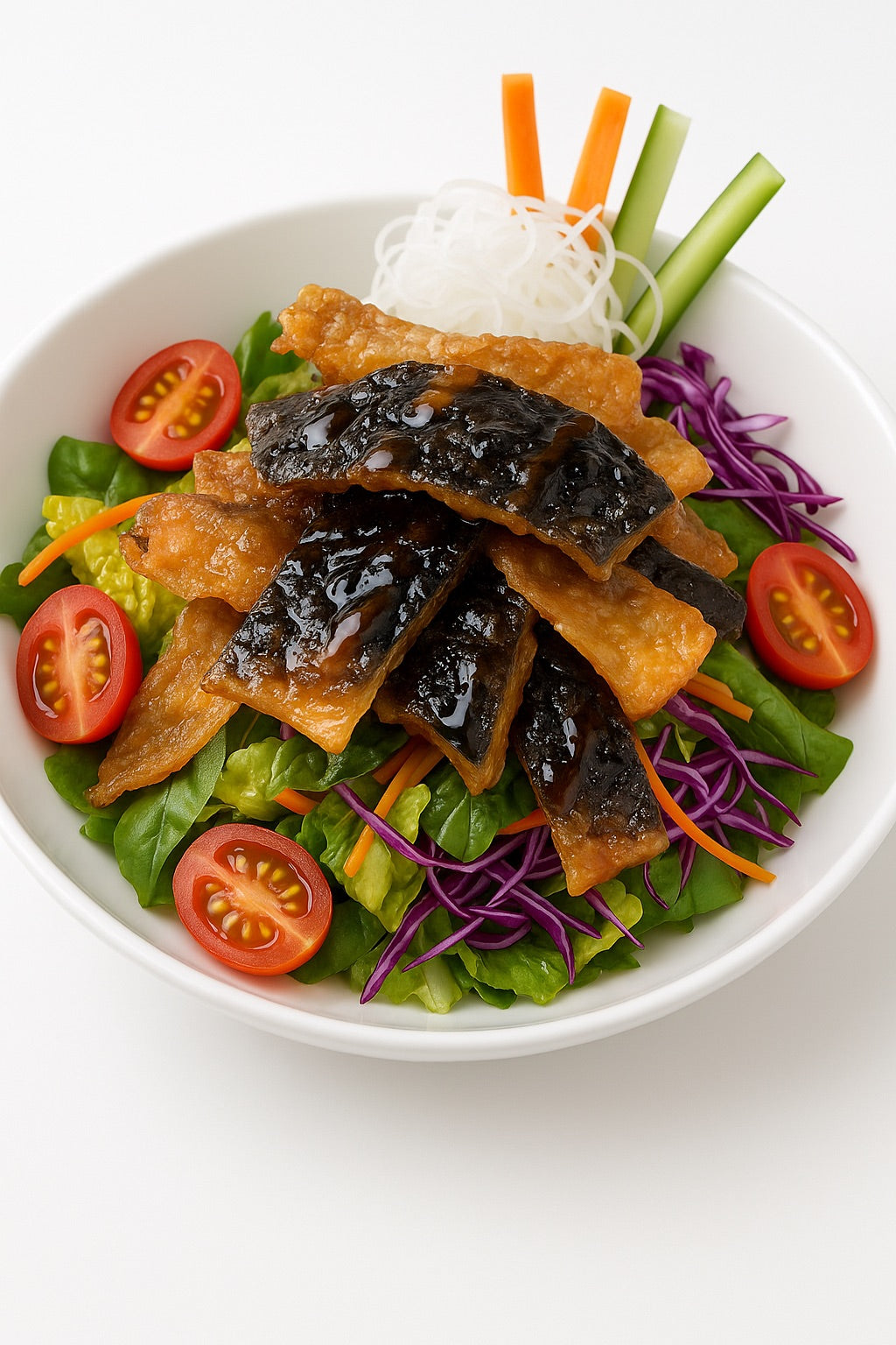 Salad with crispy salmon skin, vegetables, and a white bowl on a white background