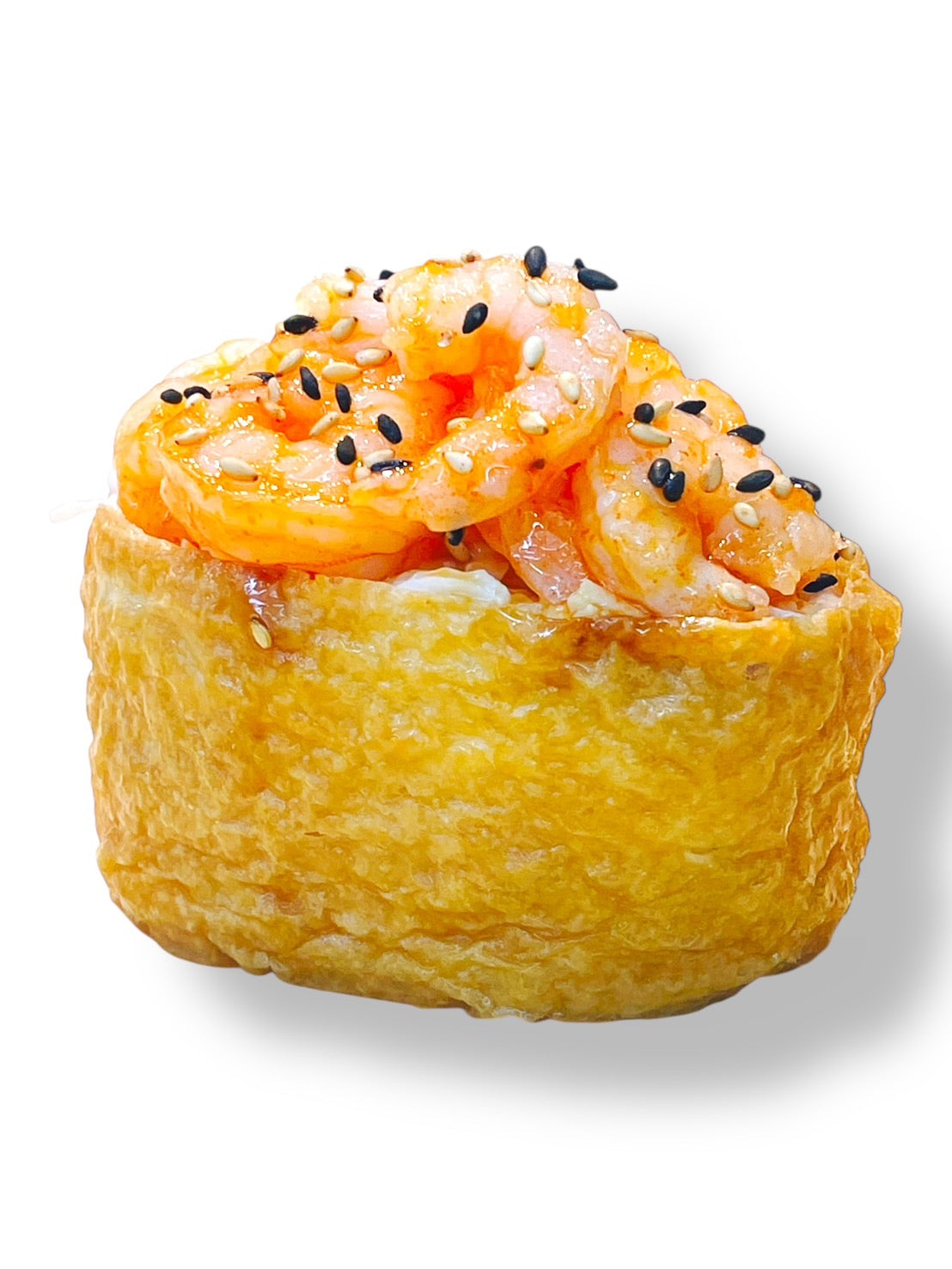 Inari sushi filled with rice and topped with spicy shrimp, coated in a bright orange sauce and sprinkled with black and white sesame seeds.